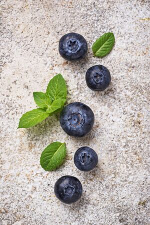 Fresh ripe blueberries on light concrete backgroundの写真素材