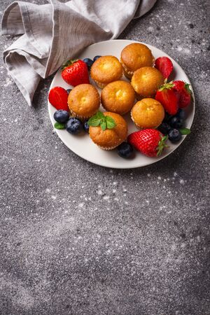 Summer mini cupcakes with berryの写真素材