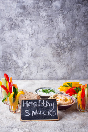 Snacks bar. Vegetables sticks and hummus