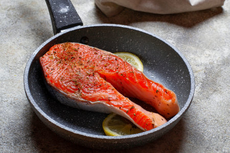 Fresh salmon steak with spices ready to cookingの写真素材