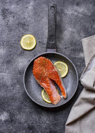 Fresh salmon steak with spices ready to cookingの写真素材