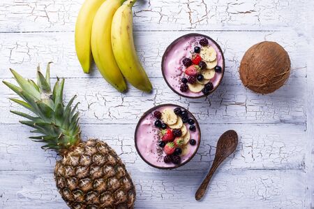 Frozen dessert nice cream with acai berry in coconut bowlの写真素材