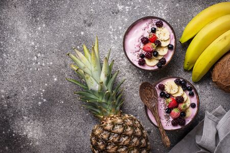 Frozen dessert nice cream with acai berry in coconut bowlの写真素材