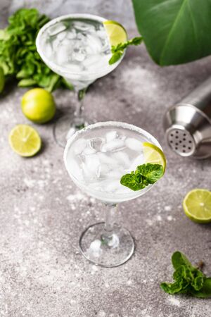 Traditional Margarita cocktail with lime and iceの写真素材