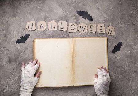 Halloween Background with mummyâs hands. Space for textの写真素材