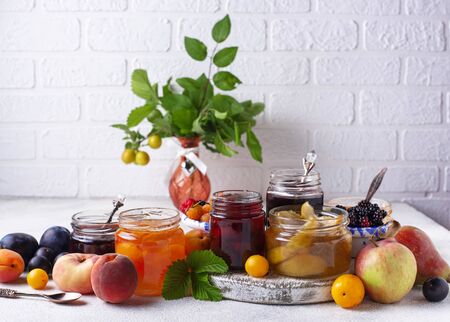 Assortment of different homemade jams in garsの写真素材