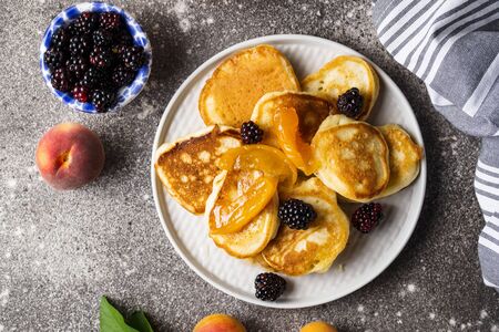 Homemade pancakes with apricot jam and berryの写真素材