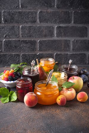 Assortment of different homemade jams in garsの写真素材