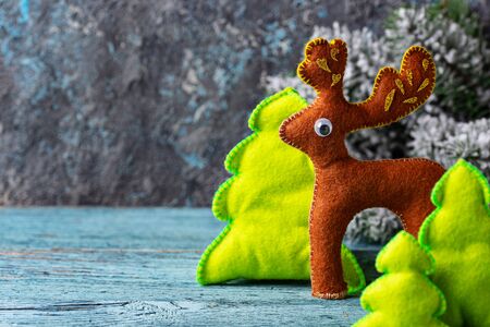 Christmas decorative fit tree toy in shape of deer made of feltの写真素材