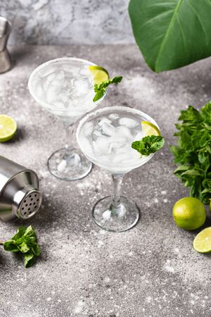 Traditional Margarita cocktail with lime and iceの写真素材