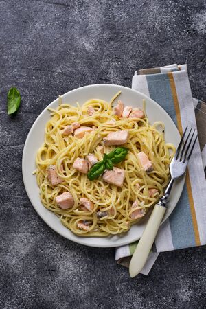 Pasta spaghetti with salmon and basilの写真素材