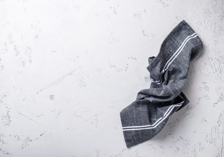 Gray linen napkin on light tableの写真素材