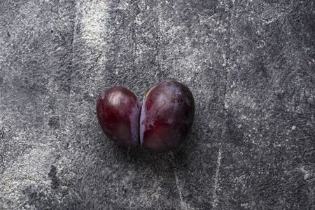 Oddly shaped plums. Abnormal organic fruitの写真素材