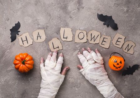 Halloween background with mummy handの写真素材