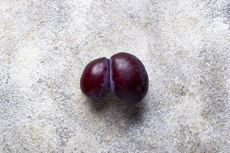 Oddly shaped plums. Abnormal organic fruitの写真素材