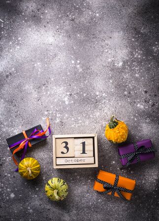 Halloween background with gift box and pumpkinsの写真素材