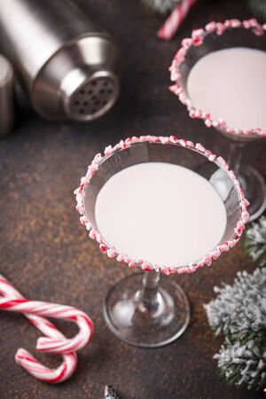 Pink peppermint martini with candy cane rim. Christmas cocktailの写真素材