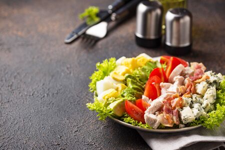 Cobb salad, traditional American food. Top view, space for textの写真素材