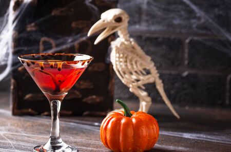 Halloweens drink red martini cocktail with chocolate rimの写真素材