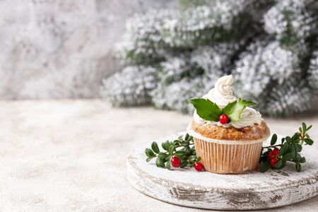 Christmas festive cupcake with holly leavesの写真素材