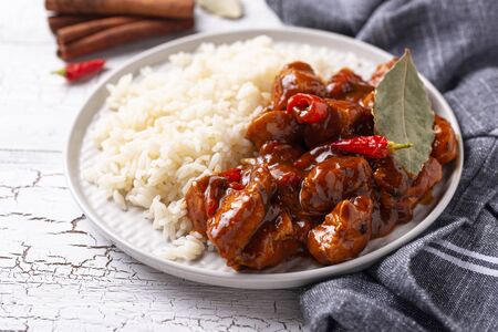 Curry chicken tikka masala with rice and spicesの写真素材