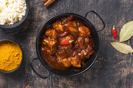 Curry chicken tikka masala with rice and spicesの写真素材