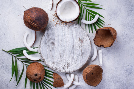 Sliced coconut and palm leaves