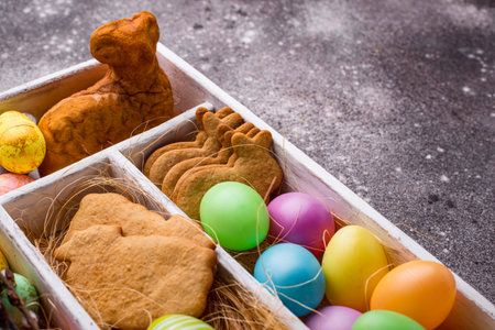 Box with Easter cookies and eggs