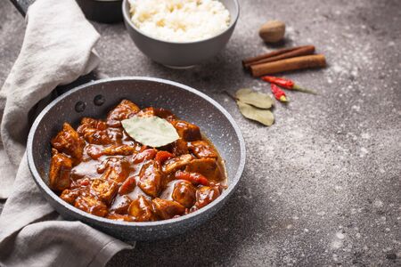 Curry chicken tikka masala with rice and spicesの写真素材