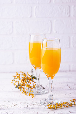 Mimosa cocktail with champagne and orange juiceの写真素材