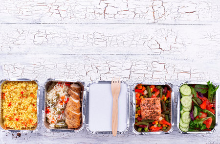 Food delivery concept. Lunch in container on wooden table