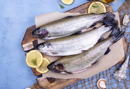 Raw uncooked trout with lemonの写真素材
