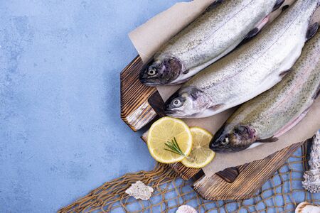 Raw uncooked trout with lemonの写真素材