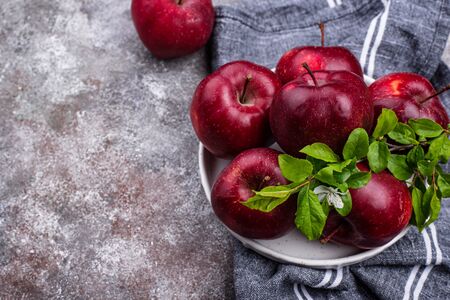 Fresh red ripe apples on gray backgroundの写真素材