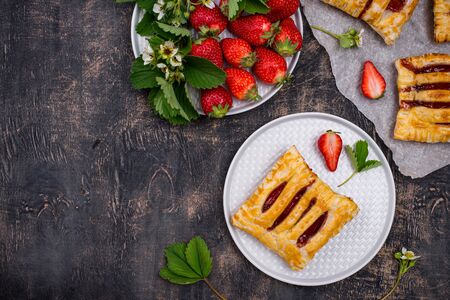 Sweet puff pastry cakes with strawberryの写真素材