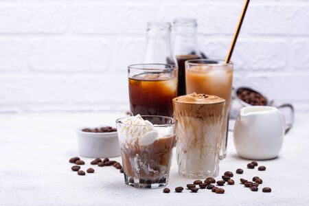 Different trendy coffee drink. Cold brew coffee, espresso tonic, ice cream latte and dalgona coffeeの写真素材