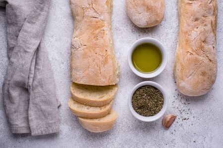 Homemade French baguettes with olive oilの写真素材