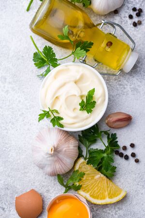 Homemade mayonnaise sauce with ingredientの写真素材