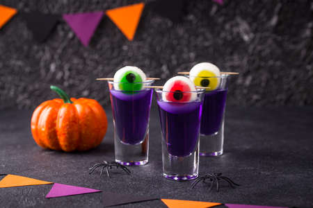 Halloween purple cocktail with eyes.の写真素材