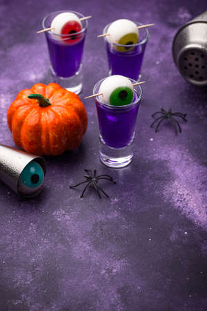 Halloween purple cocktail with eyes.の写真素材