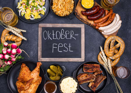 Oktoberfest dishes with beer, pretzel and sausageの写真素材