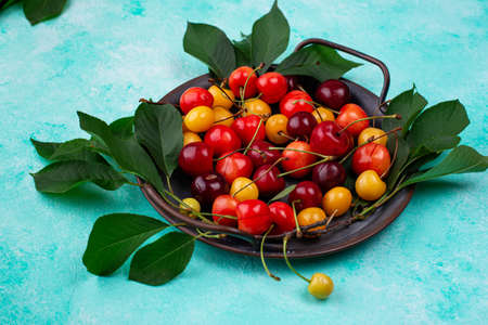 Fresh ripe red and yellow cherryの写真素材