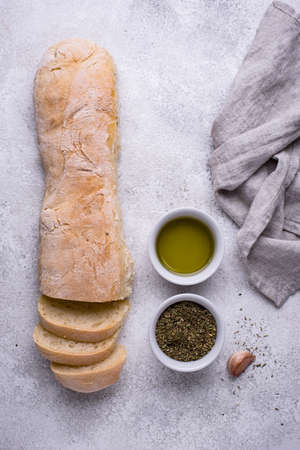 Homemade French baguettes with olive oilの写真素材