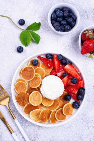 Sweet pancake cereals with berriesの写真素材