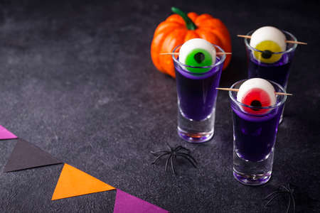 Halloween purple cocktail with eyes.の写真素材