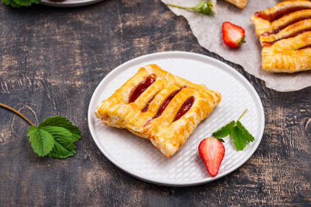 Sweet puff pastry cakes with strawberryの写真素材