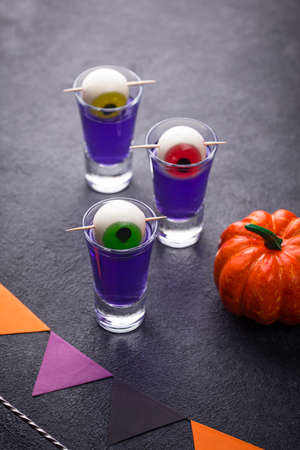 Halloween purple cocktail with eyes.の写真素材