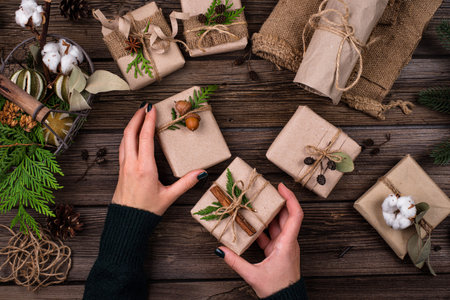 Christmas gift boxes in craft paperの写真素材