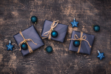 Christmas gift boxes in blue paperの写真素材