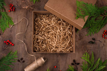 Open Christmas craft gift box with paperの写真素材